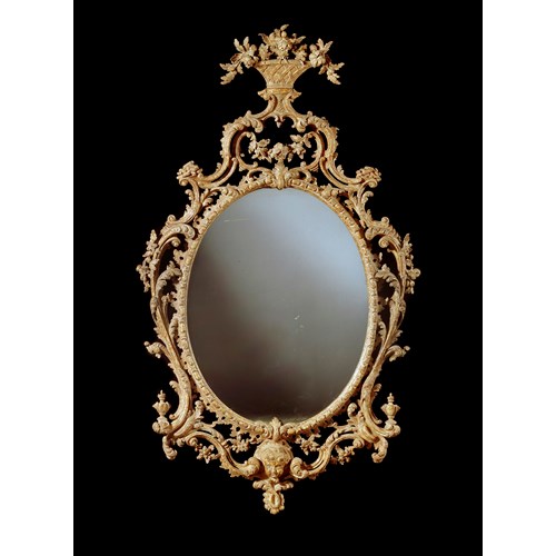 A George III giltwood oval mirror